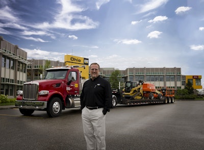 Third-generation Ohio Machinery owner Ken Taylor in front of Ohio Cat’s corporate headquarters in Broadview Heights, Ohio.