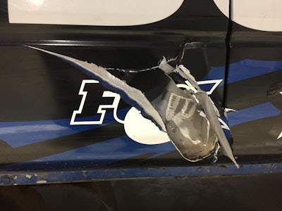 The big ‘Oops!’ on the driver-side door.