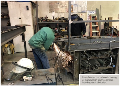 two metal fabrication technicians at Evans construction
