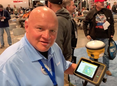 Casey Cyrus demonstrates the Trimble SPS986 tilt-compensated rover at ConExpo.