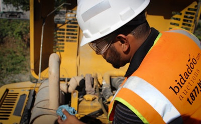 Auction equipment inspections are typically solitary affairs, safely done at a distance from others on a site.