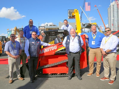 Representatives from National Equipment Dealers and Manitou pose for a photo at ConExpo 2020.