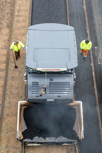Dynapac SD2500CS paver inaction with construction roadwork crew