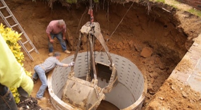 An OSHA-provided photo of a septic liner installation just before a fatal excavation collapse.