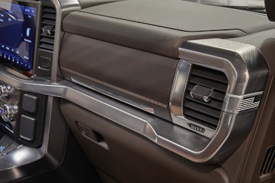 All-new F-150 King ranch-exclusive “Norias” brown leather wraps around the front instrument panel, which ends with an imprinted metalized American flag.