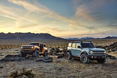 Pre-production versions of the 2021 Bronco, shown here, include Bronco two-door in Cyber Orange Metallic Tri-Coat and Bronco four-door in Cactus Gray.