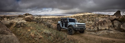 Pre-production 2021 Bronco four-door Badlands series with available Sasquatch™ off-road package in Cactus Gray with the doors, top and rear quarter windows removed.