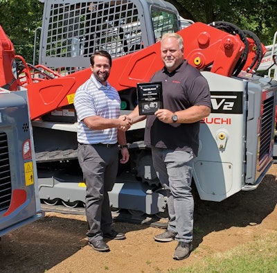 Salesman of the year presentation: Steve DePriest, Takeuchi regional business manager, Southeast region and Bill Smith, Cobb County Tractor.