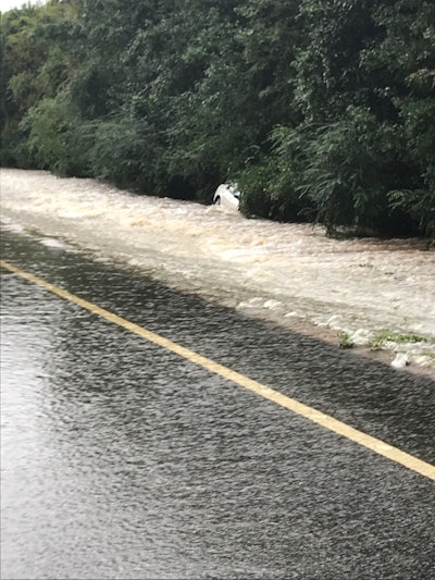 This driver apparently tried to cross where a portion of the roadway has collapsed on North State Road 85 near Laurel Hill, Florida. No one was injured. Photo credit: Okaloosa County Sheriff’s Office