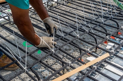 Carbon fiber strands being installed on the M-102 bridge deck in Wayne County. Photo credit: Michigan DOT