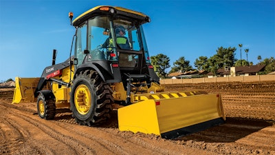 The Deere 210L box blade both cuts grade and spreads materials.