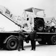 1964 – JCB exports its first machine, a 4C bakchoe, to the USA. Mr Bamford is pictured left
