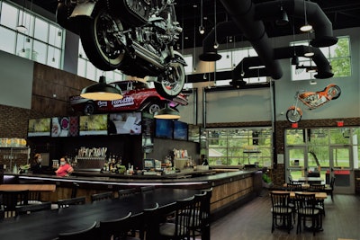 Inside and out, too, as you’ll see, some pieces of local racing history. Berkstresser pointed out the drag car above the bar seen in this picture belonged to Pete Eavers in the 1960s. “It was one of the fastest cars on the East Coast in its class,” he said.