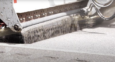 High friction surface treatment being applied in St. Louis County, Minnesota. Credit: Minnesota Local Road Research Board