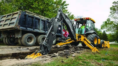John Deere L-Series Backhoe digging trench
