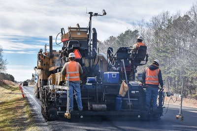 crews monitoring asphalt paving temperature with Cat Thermal Mapping