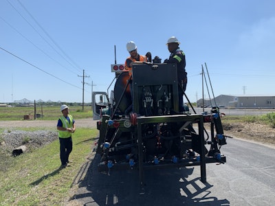 workers using High-Volume Maintenance Vehicle
