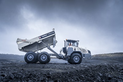 The Terex TA300 has a Scania DC9 engine rated at 370 gross horsepower mated to an EP320 transmission. Rated capacity is 30.9 tons or 22.9 cubic yards heaped. An independent front suspension improves comfort and traction. Fully enclosed, oil-cooled, multi-disc brakes at all six wheels provide strong stopping power. The cab features tilt/telescope steering, an adaptive air suspension seat with adjustable armrests and acoustic insulation for noise reduction.