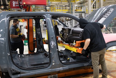 Employees at FCA’s Sterling Heights (Mich.) Assembly Plant install the instrument panel on the first Ram 1500 TRX Launch Edition, adorned in an exclusive Anvil exterior paint. FCA invested nearly $1.5 billion to retool the plant to build the next generation Ram 1500, which launched in 2018, and support the future growth of the Ram brand.