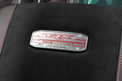 The Ram 1500 TRX Launch Edition features a special red and brushed-aluminum center console badge identifying it as VIN #0001, a limited-edition Ram 1500 TRX Launch Edition model.