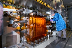 General Motors Fuel Cell Controls and Process Engineer Joe Truchan operating a coating machine