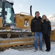 Dirtworks Scott and Dianne Johnson standing in front of a track loader