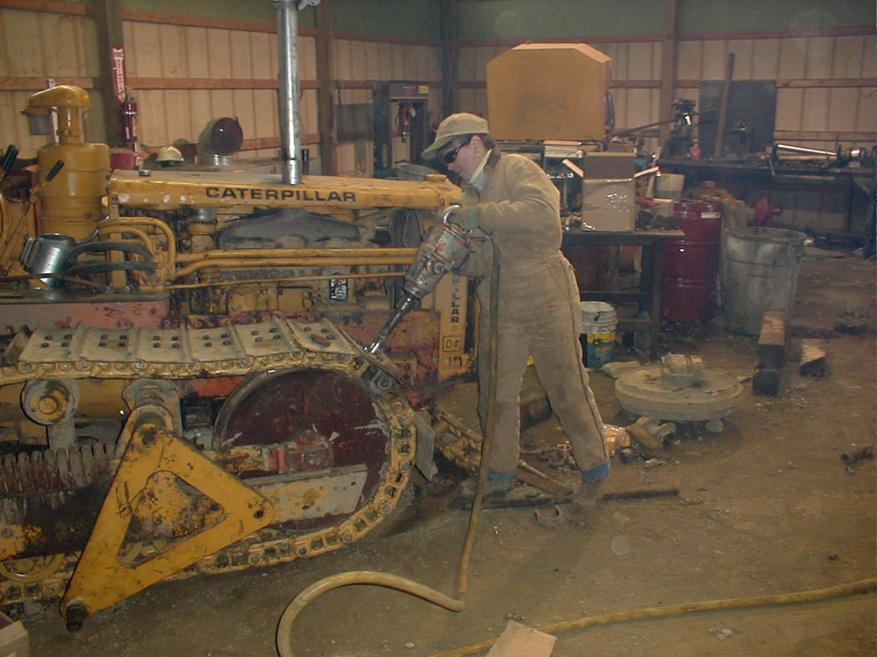 Nancy McDonnell works on restoring her 1956 Cat D4.