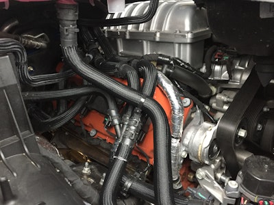 Dar she blows! A supercharger is a beautiful thing. Below that amazing crown, HEMI orange valve covers provide a nice touch and strong reminder of Mopar’s racing roots.