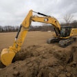 Cat 336 excavator digging trench