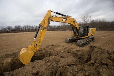 Cat 336 excavator digging trench