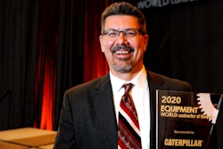 Toby Drake, owner of Drake Construction in Kotzebue, Alaska, holds his trophy after being named the 2020 Contractor of the Year.