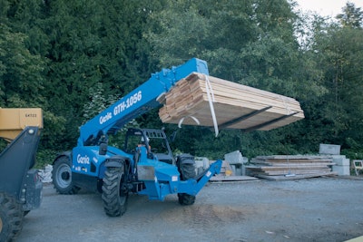 Genie GTH-1056 telehandler moving lumber