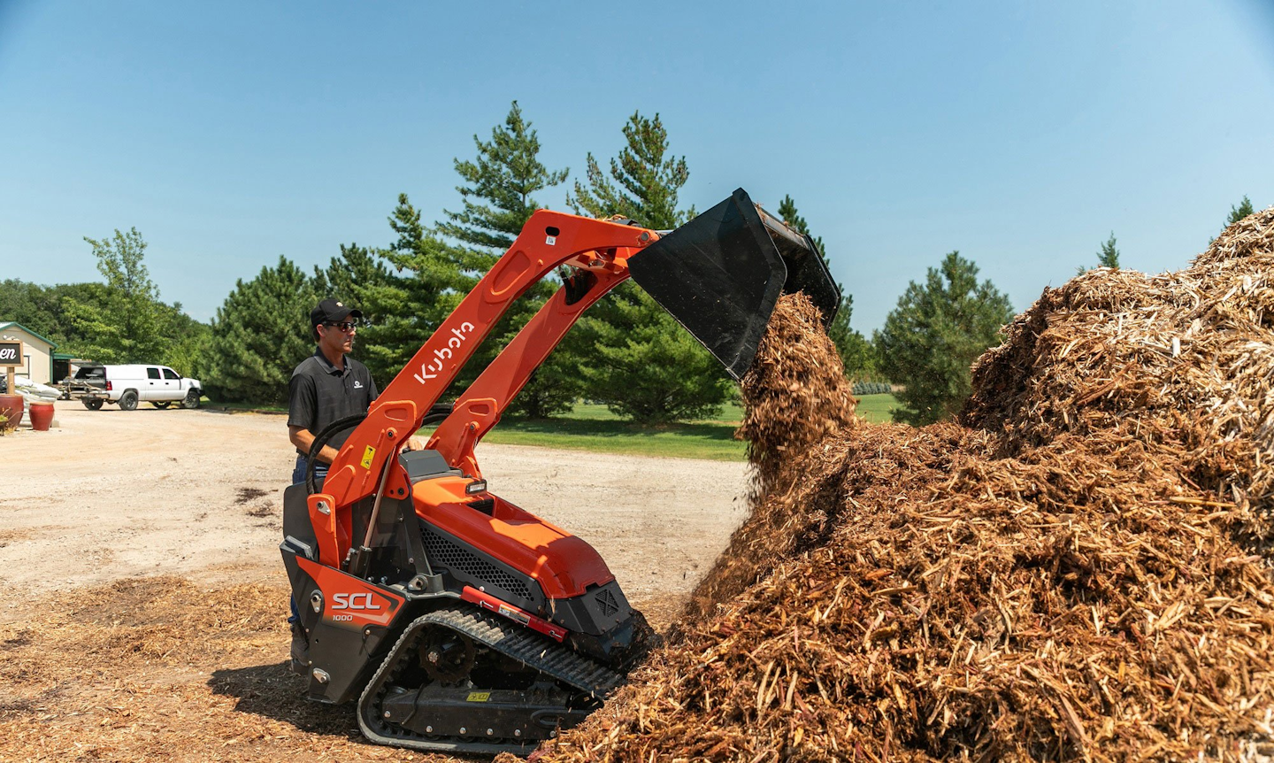 Kubota incorporated many design elements of its compact track loaders in developing its first CUL, the SCL1000. Controls are pilot operated. Standard features include keyless start with passcode protection, 12-volt charging port and a 4.3-inch LCD color dash monitor. Push-button control of auxiliary hydraulics is built into the loader control handle. Cushioned loader boom cylinders and an adjustable platform suspension system enhance operator comfort.