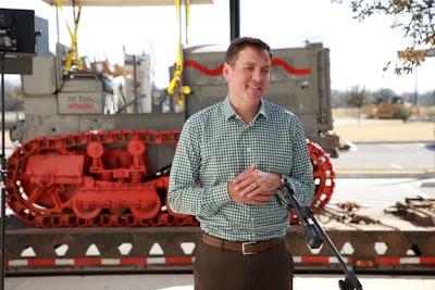 Peter Holt in front of the Holt Caterpillar 10-Ton