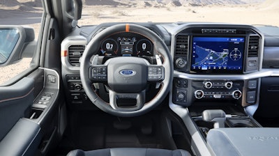 A new steering wheel features a laser-etched logo, top centering mark and aluminum paddle shifters.