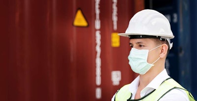 construction worker wearing hard hat and safety vest