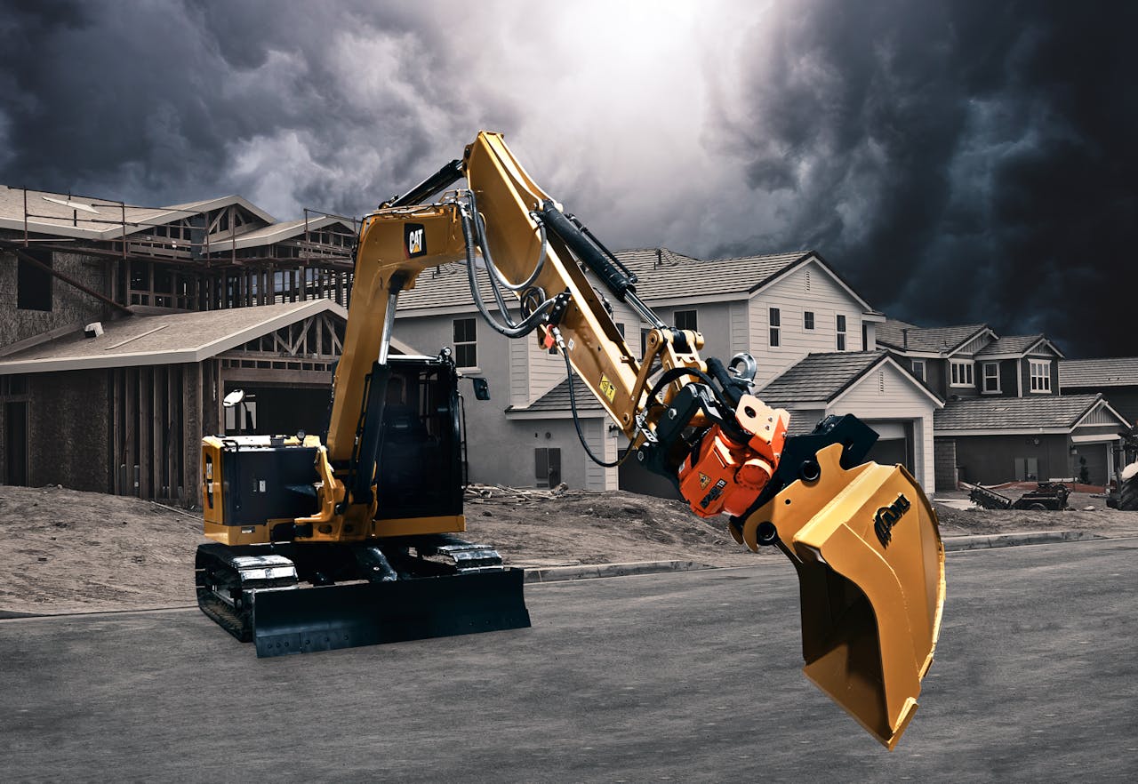 compact excavator with tiltrotator attachment in use