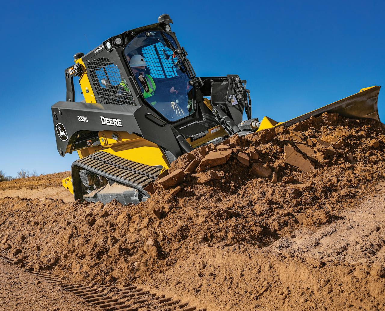 man operating deere 333g