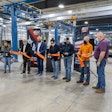 Doosan Bobcat leaders, employees and Mayor of Litchfield cutting ribbon