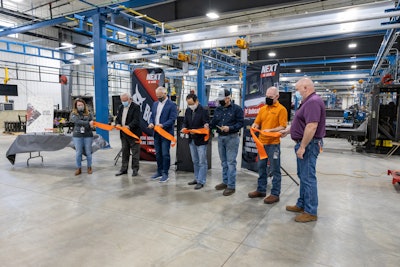 Doosan Bobcat leaders, employees and Mayor of Litchfield cutting ribbon