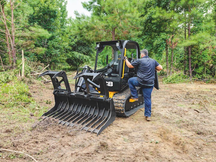 man climbing into jcv 270t equipment