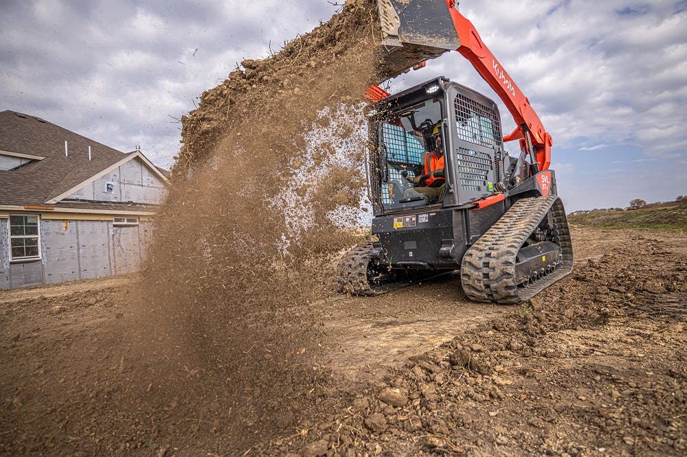 Kubota svl97-2 dumping dirt