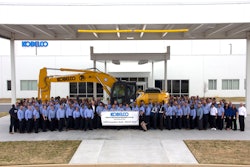 Kobelco machine surrounded by employees