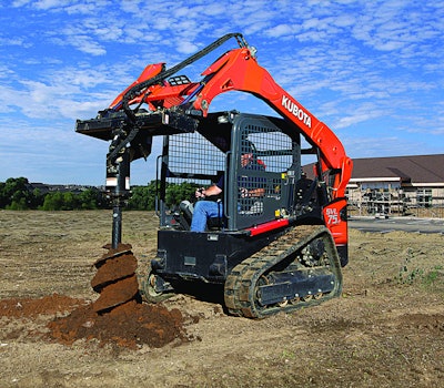man operating kubota equipment with auger attachment
