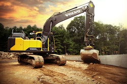 Volvo machine digging in dirt