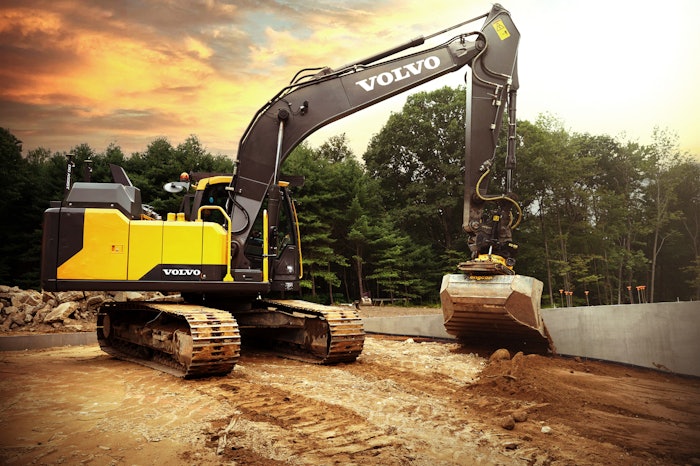 Volvo machine digging in dirt