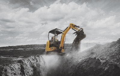 excavator dumping dirt