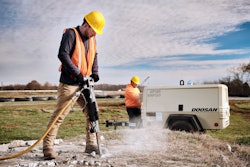 construction worker using doosan's P185-VHP165 on site