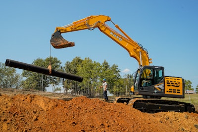 Kato excavator with pipe