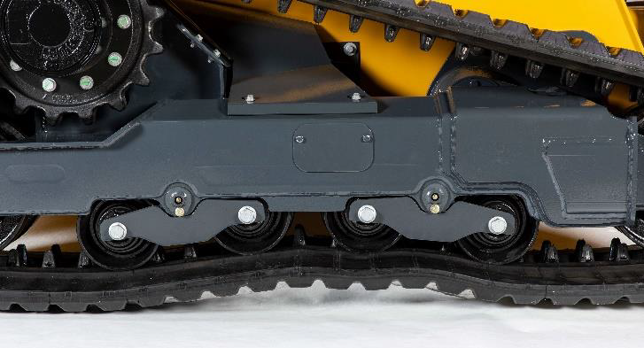 Bogie rollers in the undercarriage oscillate over uneven terrain and prevent the machine from rocking back and forth.